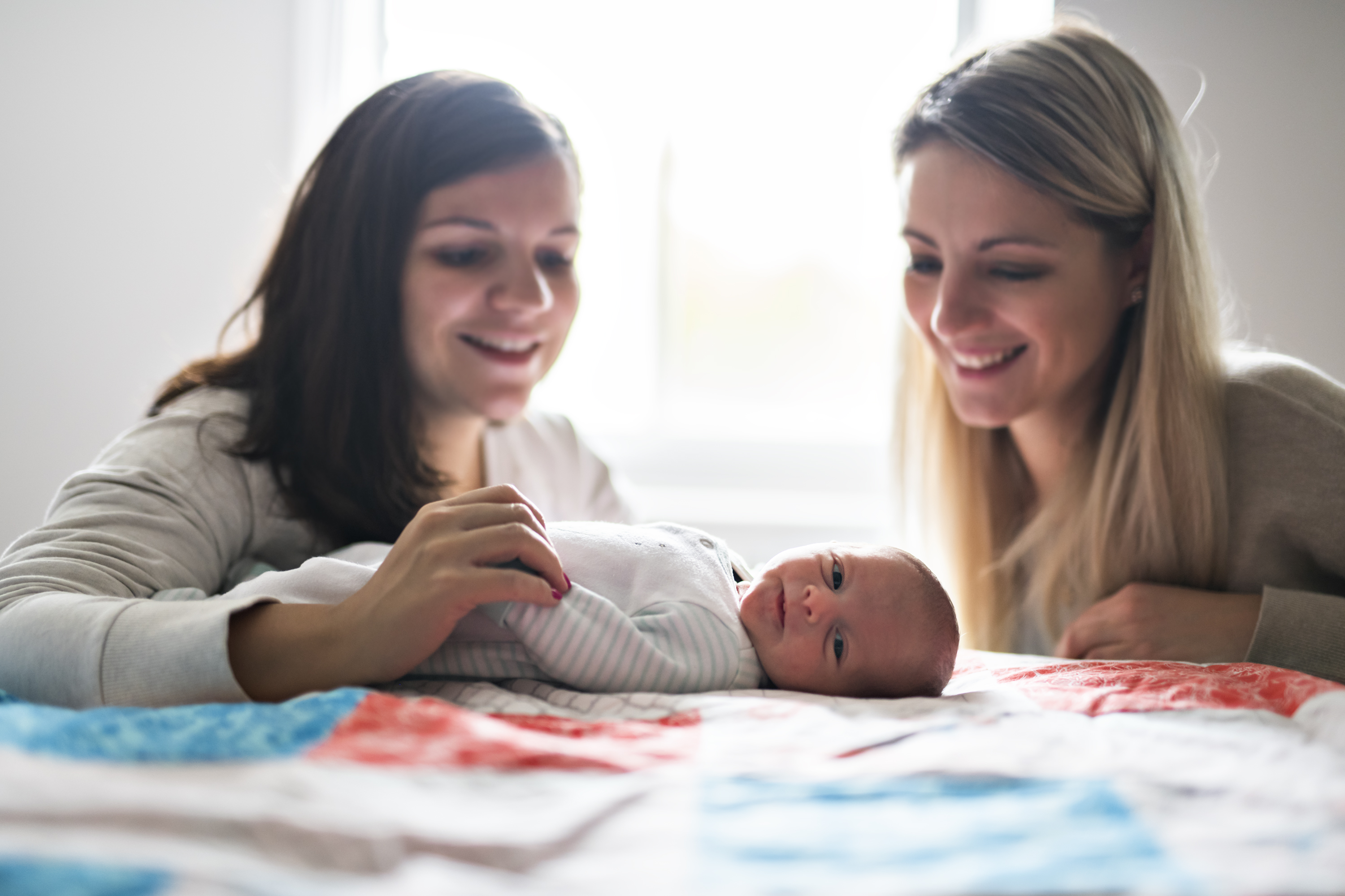 same sex couple with newborn baby for adoption and surrogacy